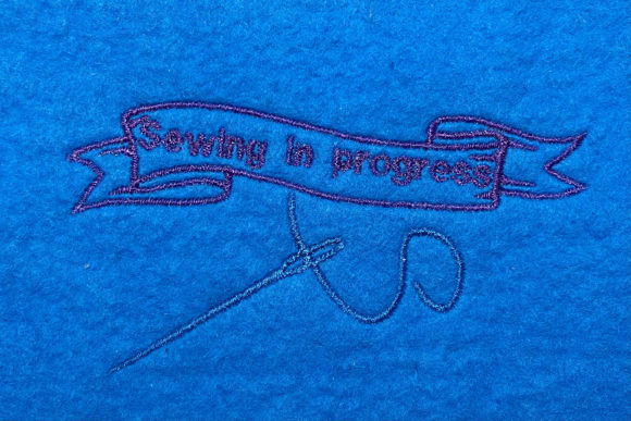 Captivating 'Sewing in Progress' Embroidery Design